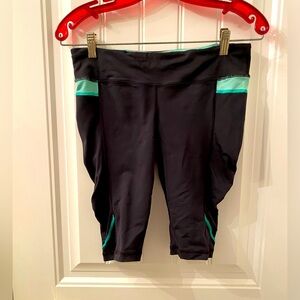 Women’s Black Lululemon Bike Shorts with Green and White Accents Size 8